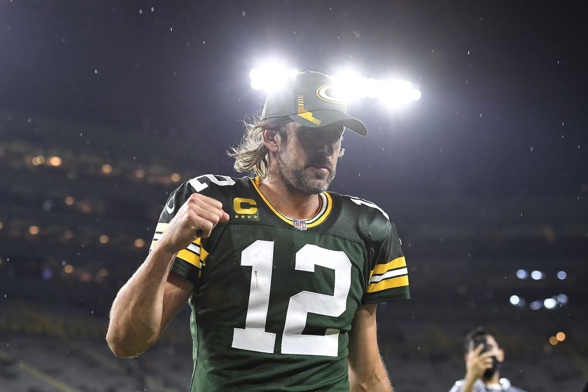Aaron Rodgers #12 of the Green Bay Packers reacts as he walks of the field following the team’s win against the Detroit Lions during an NFL football game at Lambeau Field on September 20, 2021 in Green Bay, Wisconsin.