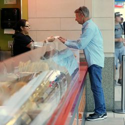 Libertarian presidential candidate Gov. Gary Johnson orders lunch at Taste of Red Iguana at the food court at City Creek Center as he and running mate Gov. Bill Weld pay a visit to Salt Lake City for a speech at the University of Utah on Saturday, Aug. 6, 2016.