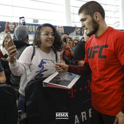 Khabib Nurmagomedov signs autographs at UFC 219 open workouts Thursday at T-Mobile Arena in Las Vegas.