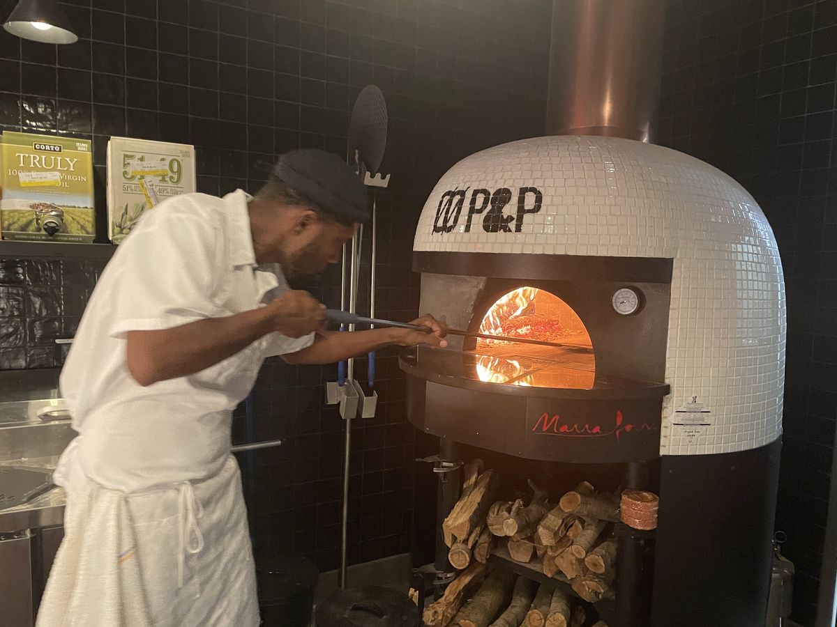 Wood-fired pizza oven.
