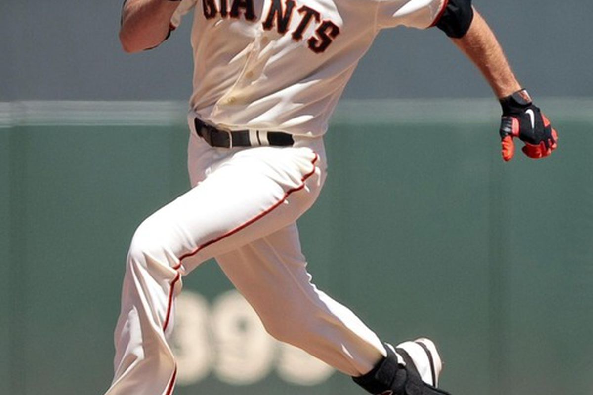 June 9, 2012; San Francisco, CA, USA; San Francisco Giants right fielder Nate Schierholtz (12) runs to third base for a triple against the Texas Rangers during the sixth inning at AT&T Park. Mandatory Credit: Kelley L Cox-US PRESSWIRE