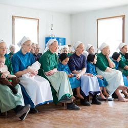 Amish women fill-up the school house to listen to their children sing during the final day of class on Tuesday, April 9, 2013 in Bergholz, Ohio. 