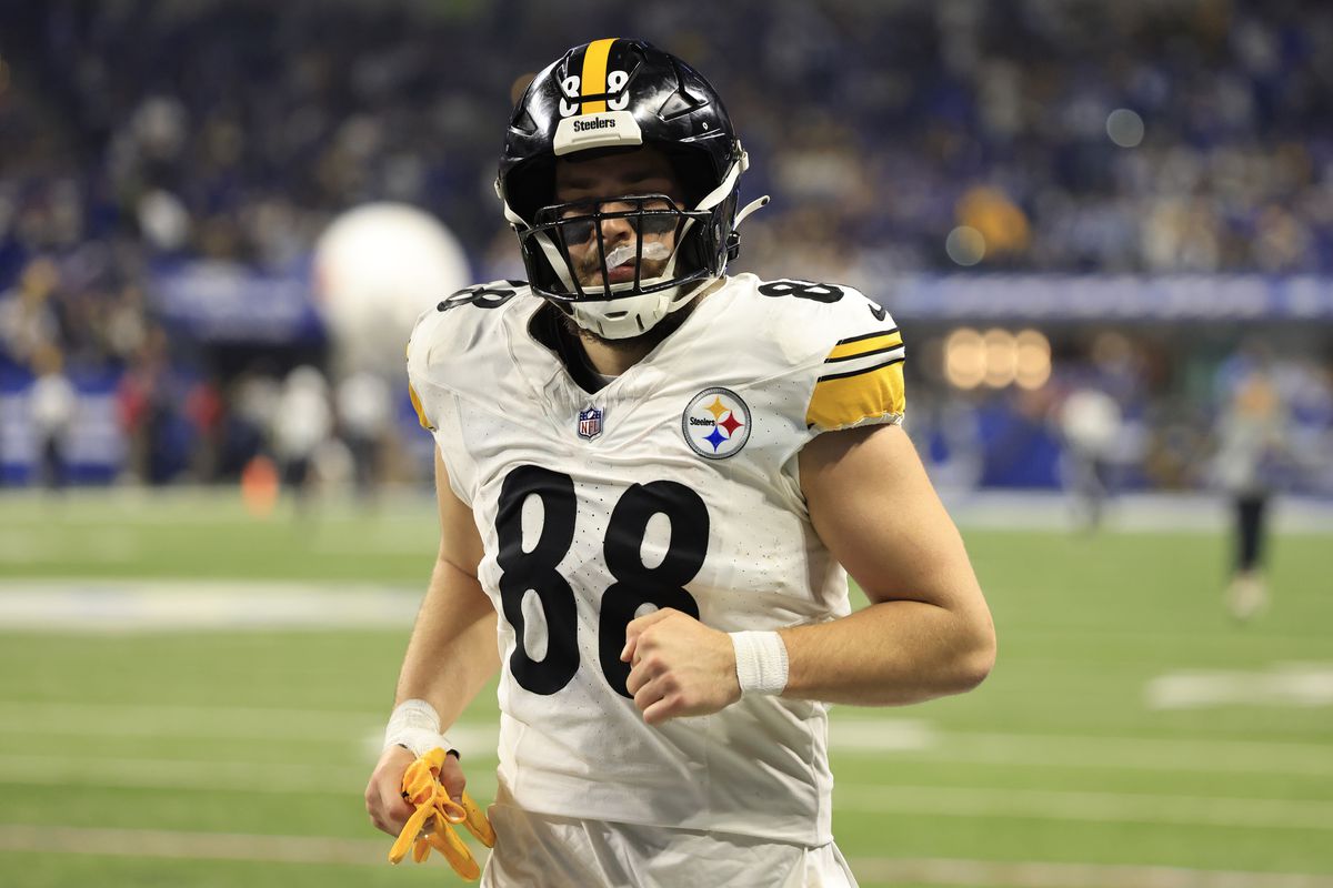 Pat Freiermuth #88 of the Pittsburgh Steelers runs off the field at halftime in the game against the Indianapolis Colts at Lucas Oil Stadium on December 16, 2023 in Indianapolis, Indiana.
