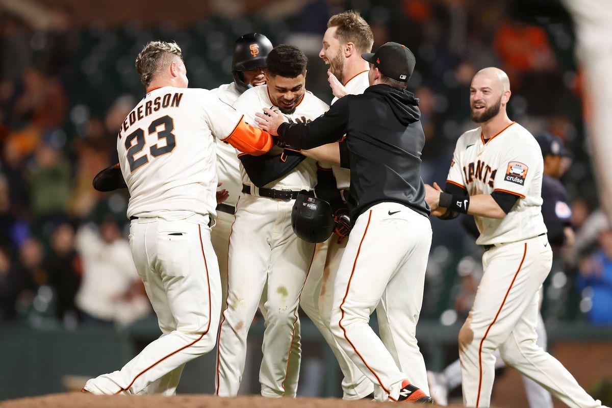 A pile of Giants celebrating after a walk-off win