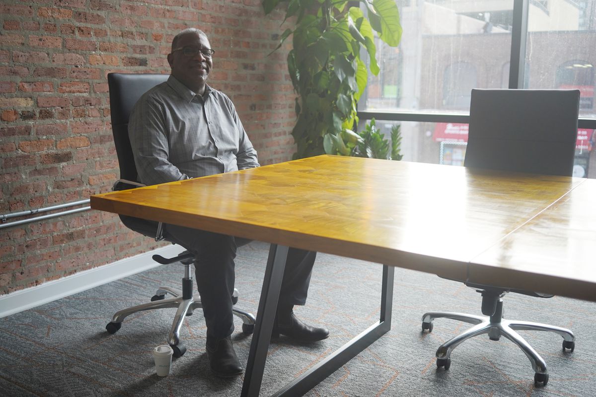 L. Brian Jenkins, owner of Entrenuity, sits in the conference room in his new South Loop co-working space Mox.E, where his non-profit company will provide business services to Black, Latino and women entrepreneurs.