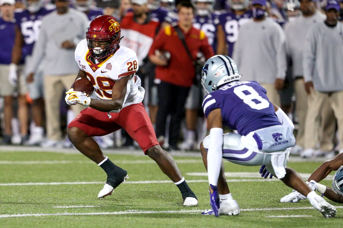 Iowa State Cyclones running back Breece Hall (28) looks for room to run against Kansas State Wildcats defensive back Tee Denson (8) during the third quarter at Bill Snyder Family Football Stadium.