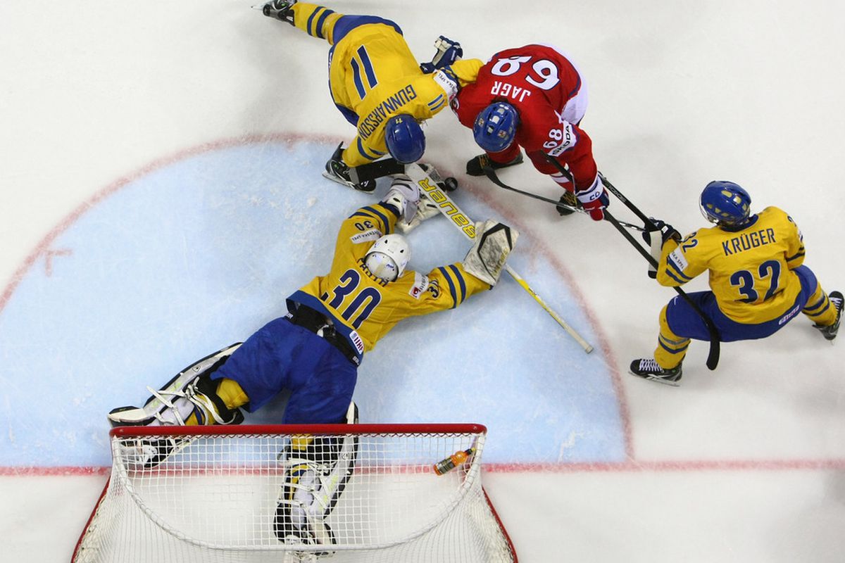 Viktor Fasth (#30), goaltender of Sweden stops Jaromir Jagr (#68) of Czech Republic during the IIHF World Championship semi final match