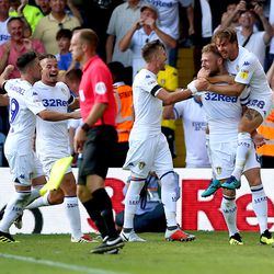 Leeds United players celebrate after Liam Cooper scores the third goal in Marcelo Bielsa’s first match in charge.