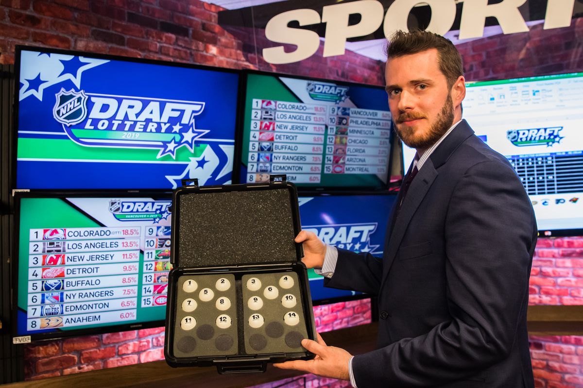 An official from Smart Play holds the lottery balls during The National Hockey League Draft Lottery at the CBC Studios on April 10, 2019 in Toronto, Ontario, Canada.