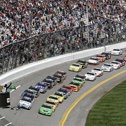 The field takes the green flag to start the DRIVE4COPD NASCAR Nationwide series auto race at Daytona International Speedway in Daytona Beach, Fla., Saturday.