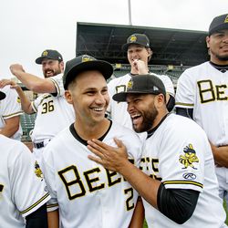 Bees players Bo Way, Jose Rojas and others laugh as the Salt Lake Bees hold their media day at Smith's Ballpark on Tuesday, April 2, 2019.