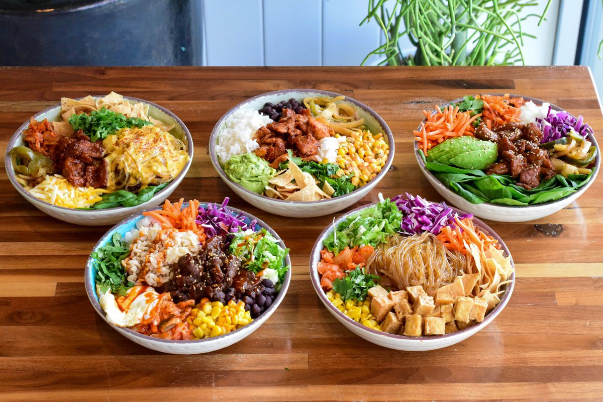 A spread of curated bowls from Chi’Lantro BBQ.