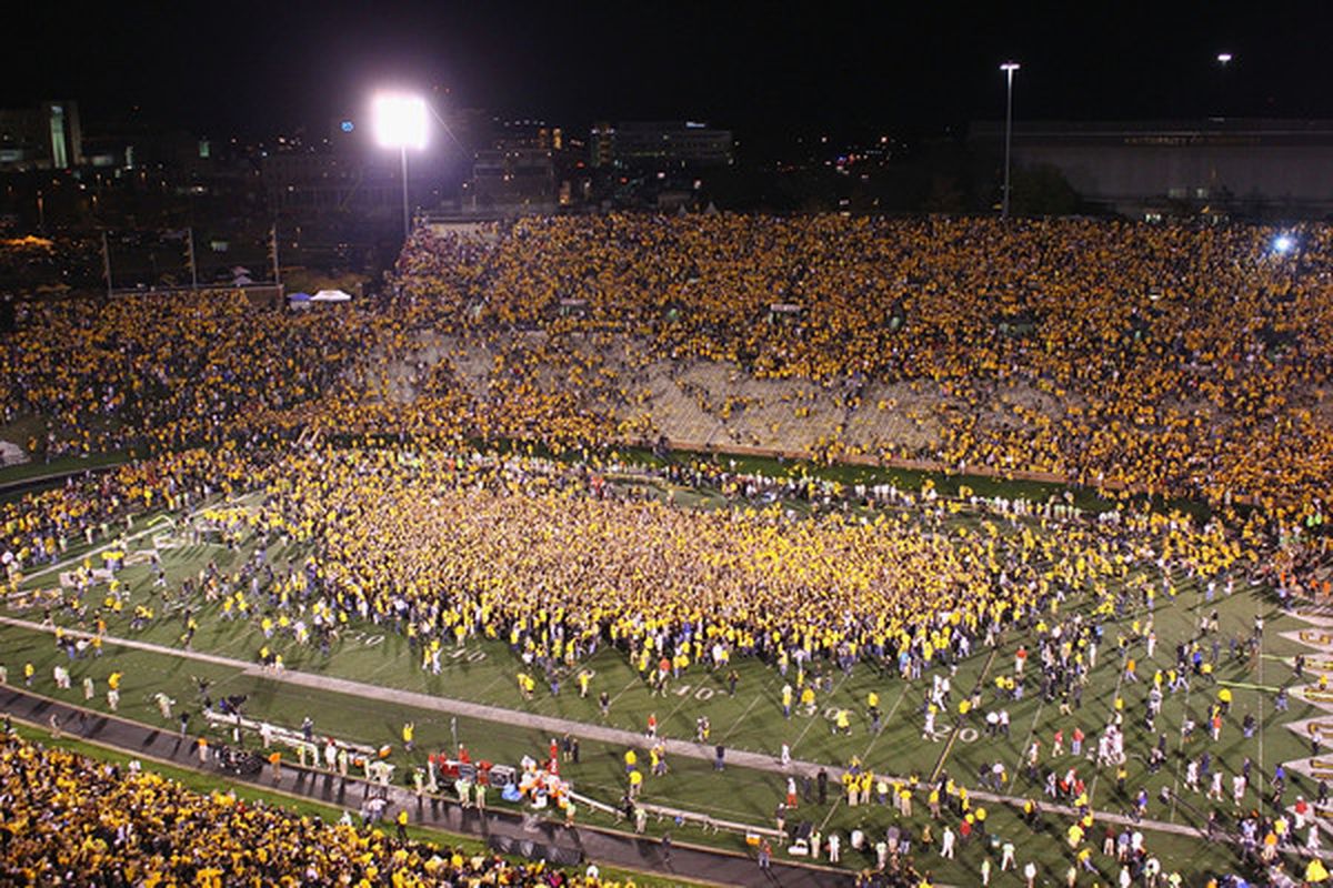 Missouri Tiger fans rushing the field after a big win against Oklahoma. The SEC wants more of this enthusiasm, Mizzou fans.