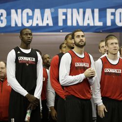 Louisville players enter the floor before practice for their NCAA Final Four tournament college basketball semifinal game against Wichita State, Friday, April 5, 2013, in Atlanta. Louisville plays Wichita State in a semifinal game on Saturday. 
