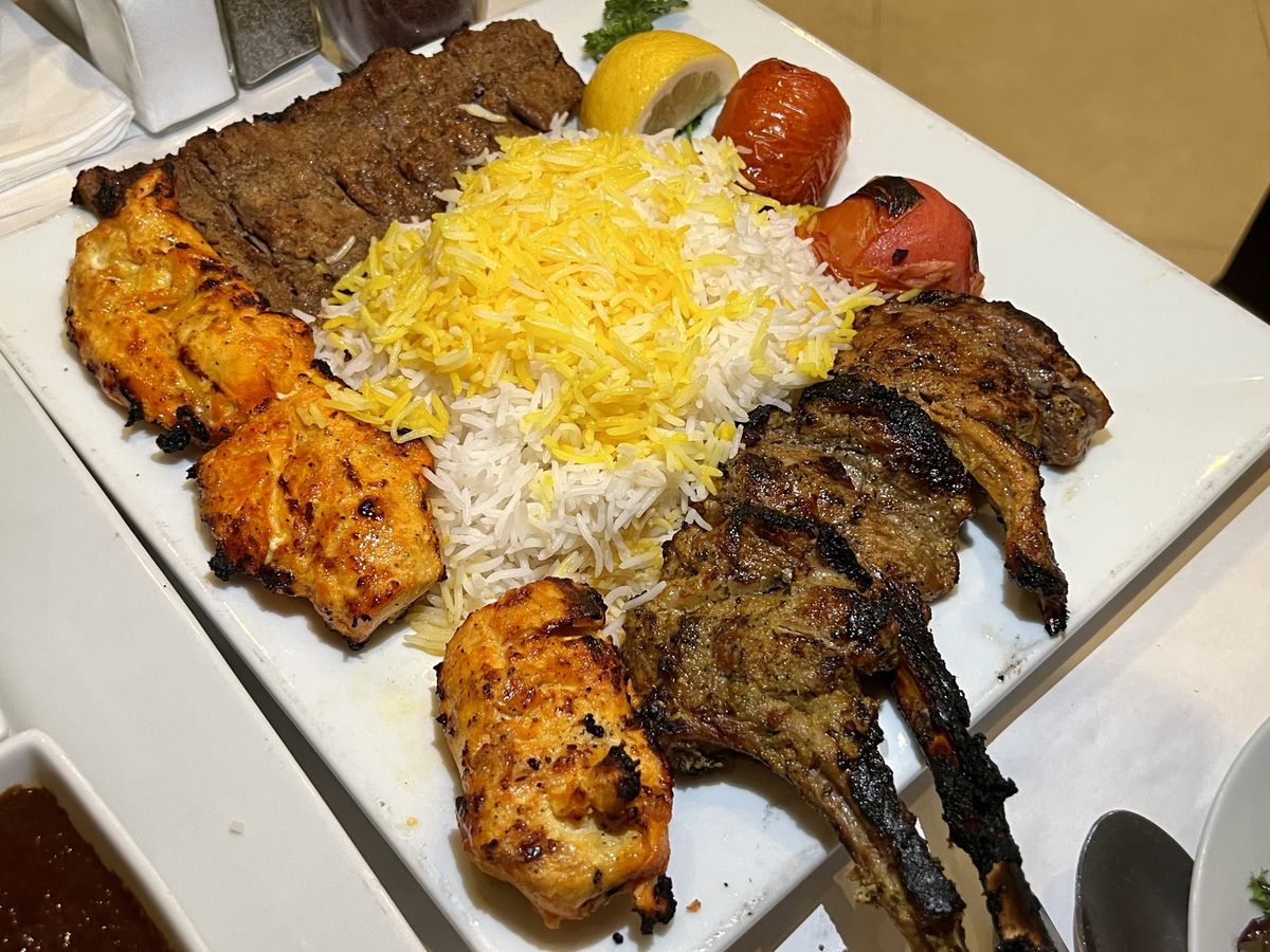 A platter of meat, rice, and vegetables at Sadaf.