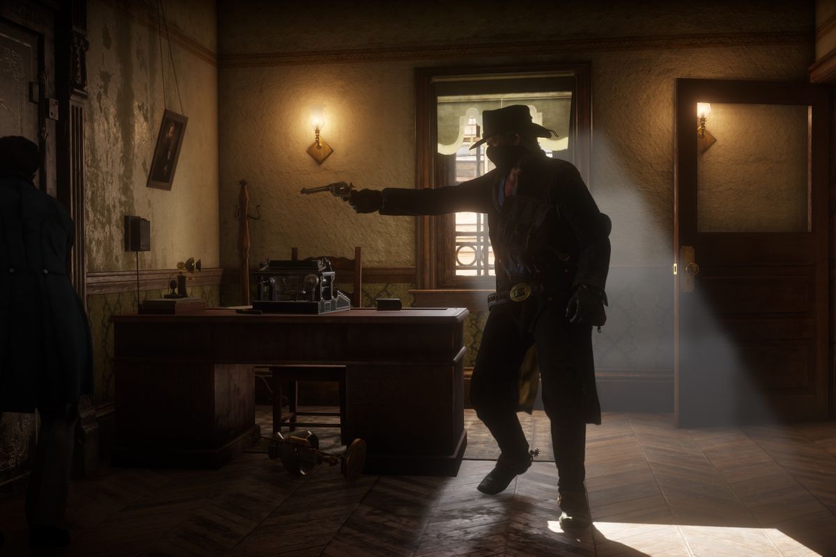 Arthur Morgan points a gun at a shopkeeper in a screenshot from Red Dead Redemption 2.