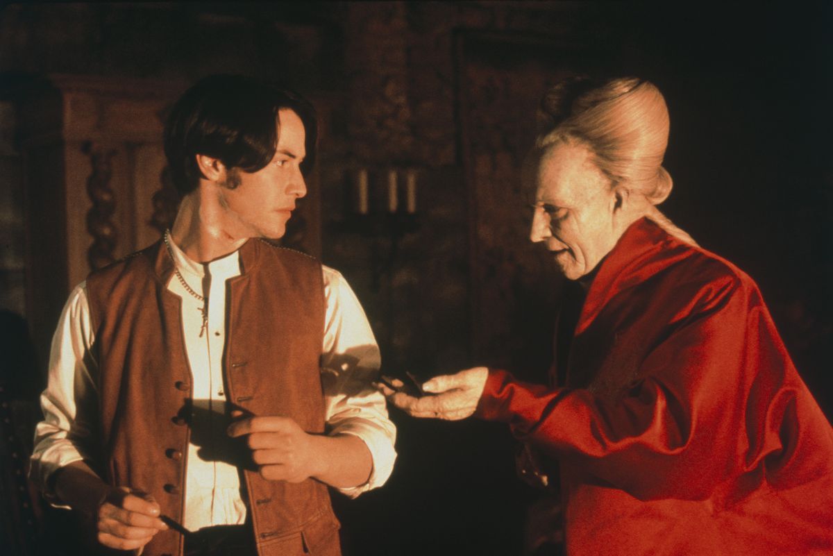 Count Dracula (Gary Oldman) reaches his hand out to Johnathan Harker (Keanu Reeves) 