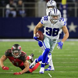 Dallas Cowboys strong safety Jeff Heath (38) runs back an intercepted pass intended for Tampa Bay Buccaneers' Adam Humphries (11) in the second half of an NFL football game, Sunday, Dec. 18, 2016, in Arlington, Texas. 