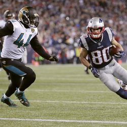 New England Patriots wide receiver Danny Amendola (80) runsto the end zone against Jacksonville Jaguars linebacker Myles Jack (44) for a touchdown after catching a pass during the second half of the AFC championship NFL football game, Sunday, Jan. 21, 2018, in Foxborough, Mass. (AP Photo/David J. Phillip)