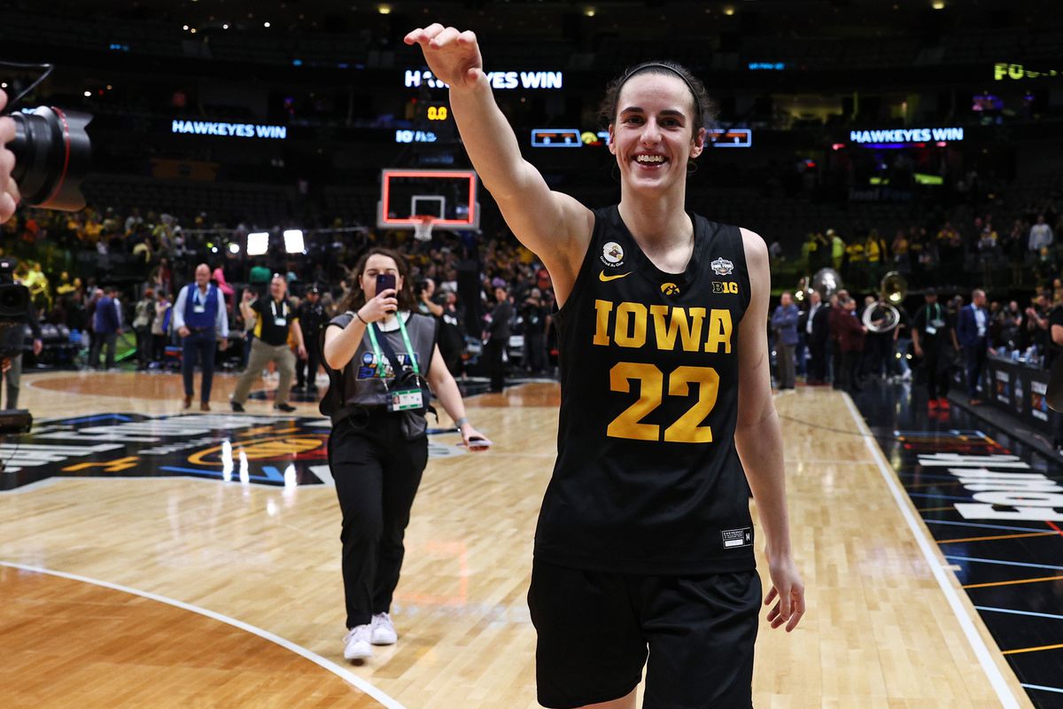 Caitlin Clark of the Iowa Hawkeyes celebrates after the Iowa Hawkeyes beat the South Carolina Gamecocks 77-73 during the 2023 NCAA Women’s Basketball Tournament Final Four semifinal game at American Airlines Center on March 31, 2023 in Dallas, Texas.