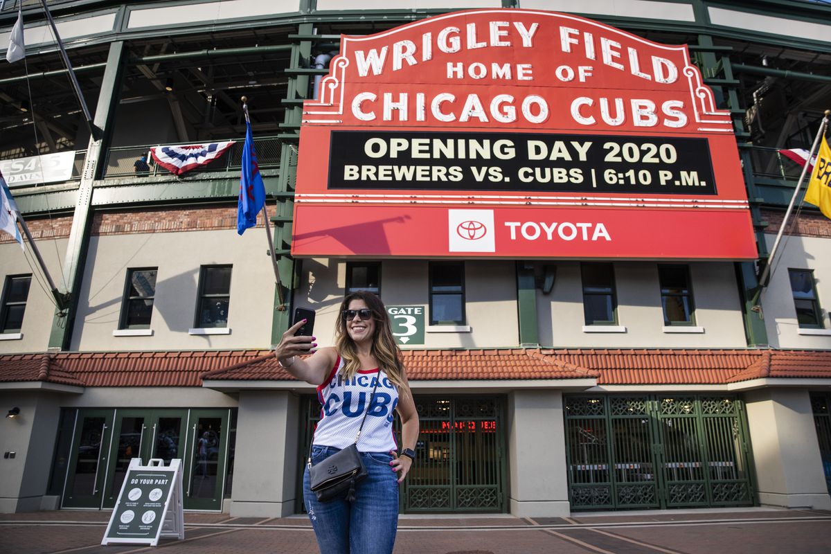 Fans take selfies outside Wrigley Field shortly before the start of the opening day game between the Chicago Cubs and the Milwaukee Brewers on July 24.