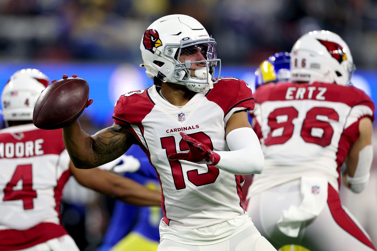 Christian Kirk #13 of the Arizona Cardinals looks to pass the ball in the second quarter of the game against the Los Angeles Rams in the NFC Wild Card Playoff game at SoFi Stadium on January 17, 2022 in Inglewood, California.