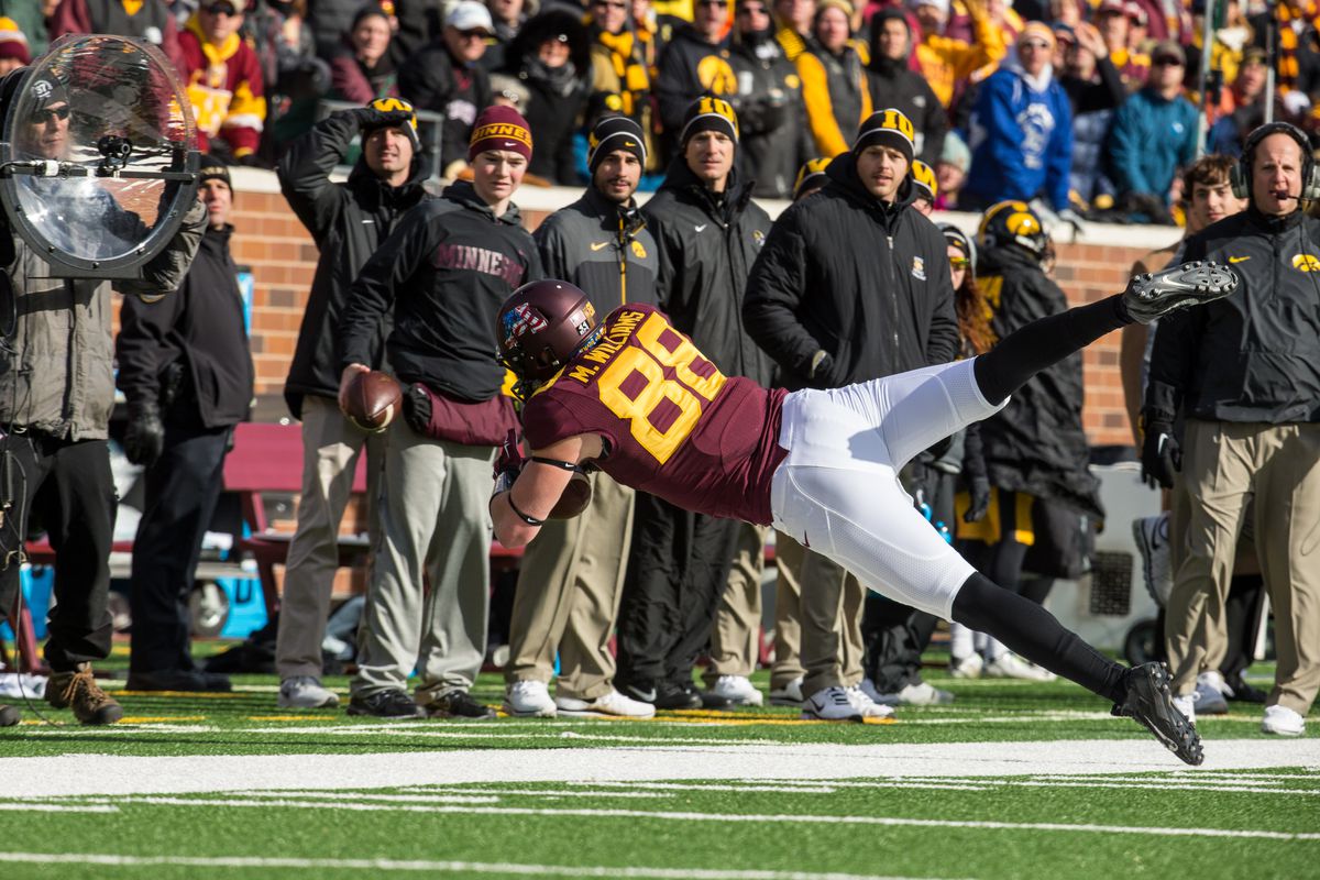 Casey O'Brien (wearing Minnesota gear on the Iowa sideline) during Maxx Williams famous "rubber wake" catch.