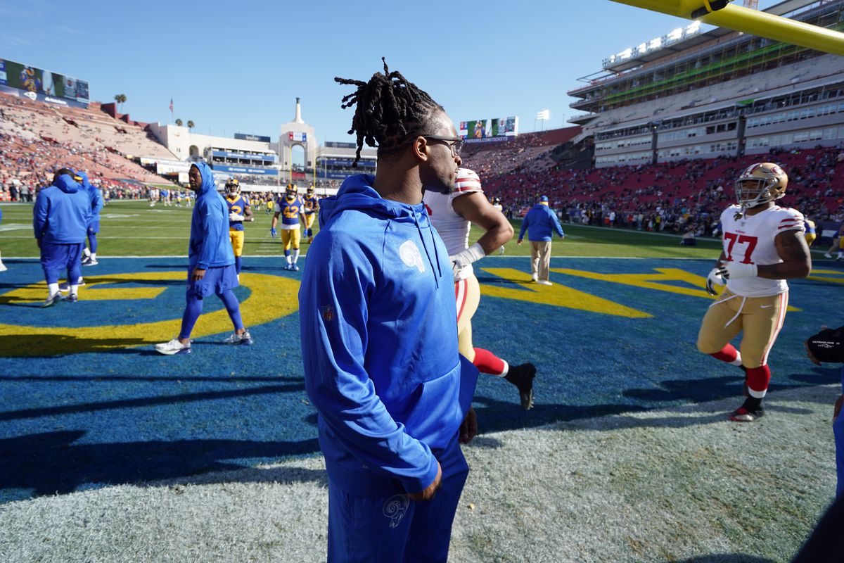 Injured Los Angeles Rams running back Todd Gurley stands on the sidelines in street clothes before the Rams’ Week 17 game against the San Francisco 49ers, Dec. 30, 2018.
