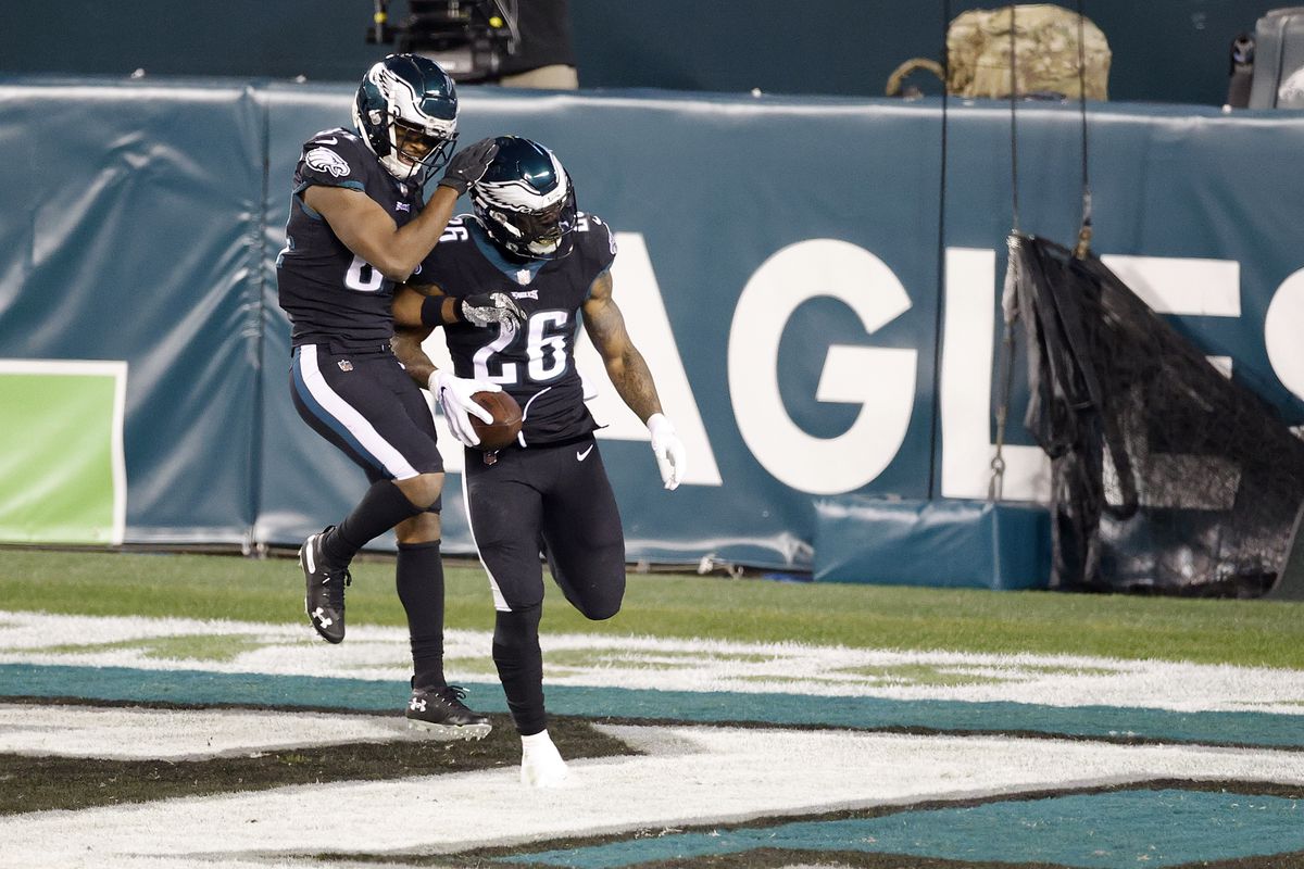 Wide receiver Greg Ward #84 celebrates with running back Miles Sanders #26 of the Philadelphia Eagles after Sanders rushed for a second quarter touchdown against the New Orleans Saints at Lincoln Financial Field on December 13, 2020 in Philadelphia, Pennsylvania.
