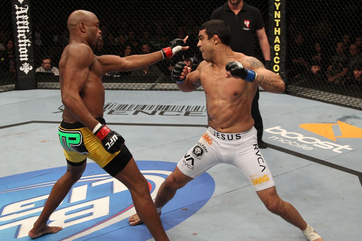 Anderson Silva fends off Vitor Belfort in their 2015 fight at UFC 126.