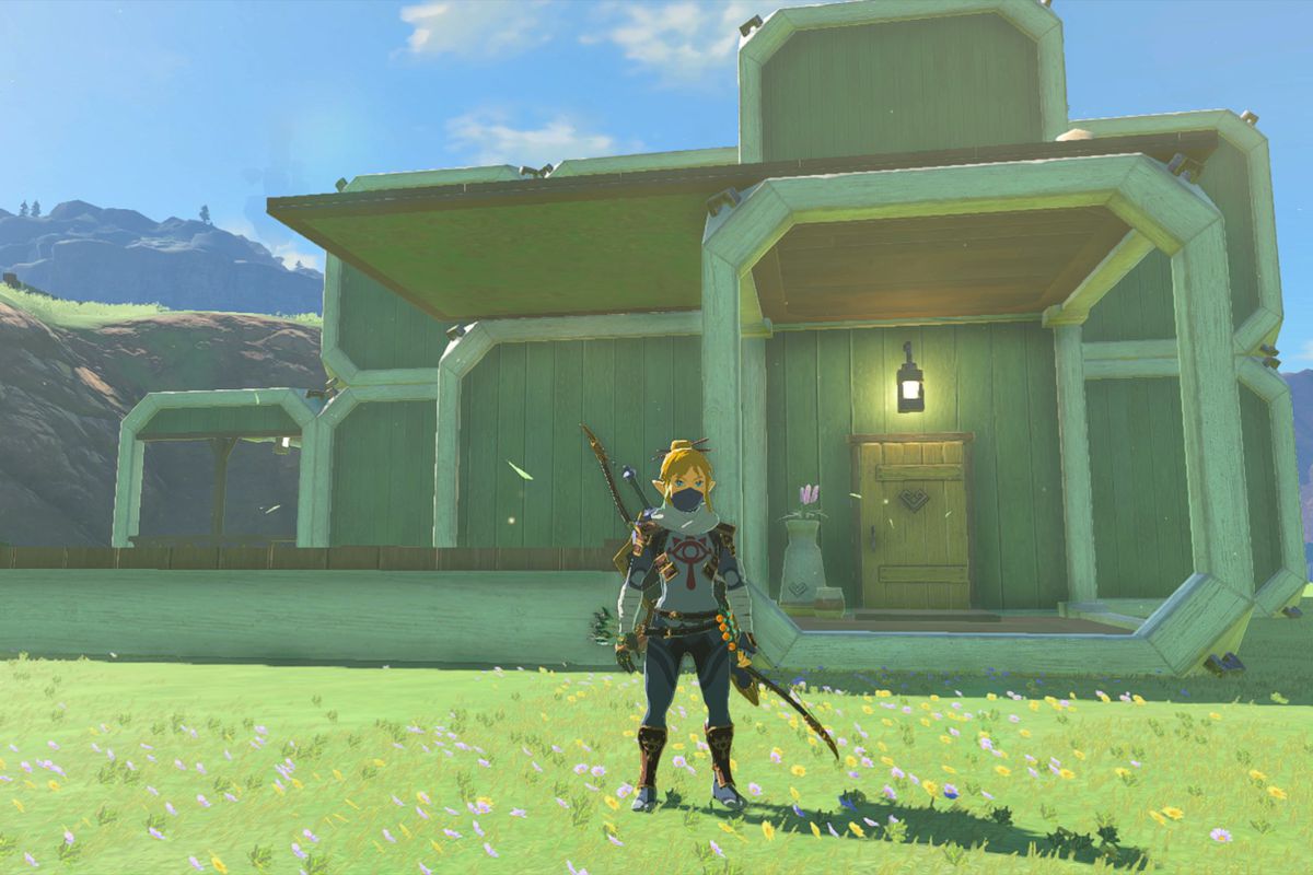 Link in the Stealth Armor standing in front of a green blocky house with a pond out front in Tears of the Kingdom