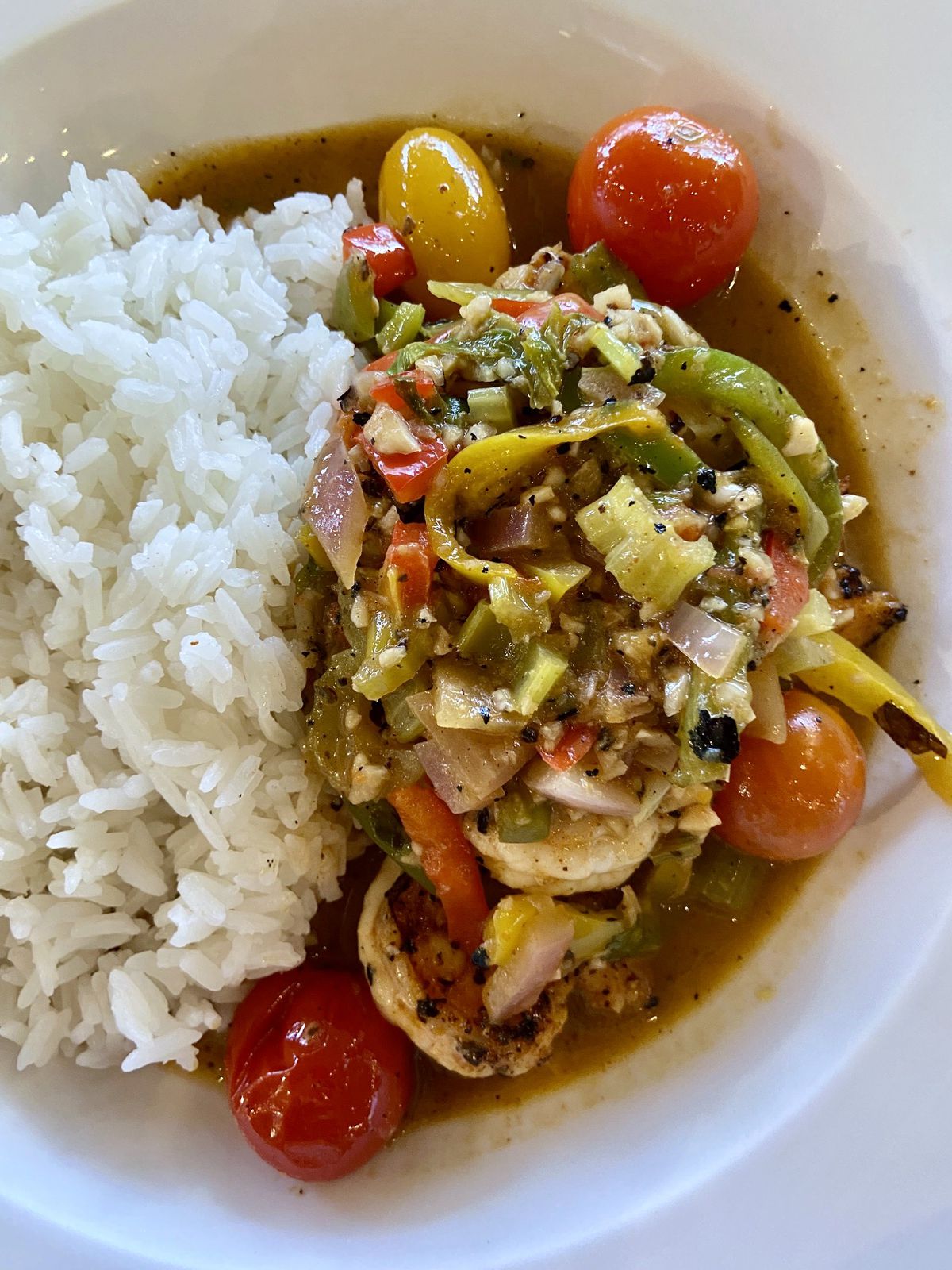 Jambalaya with rice, sauteed vegetables, plum tomatoes, and shrimp before mixing at MetroFresh in Atlanta, GA