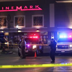 American Fork police investigate the shooting of two people near the Wal-Mart and the Cinemark Theatre in American Fork on Sunday, Dec. 4, 2016. SueAnn Sands, 39, of American Fork, was shot while she was inside her car and dialing 911 to report someone was shooting at her. Police say a former boyfriend, James Dean Smith, 33, of Orem, killed her. He was then killed in a shootout with police shortly afterward.