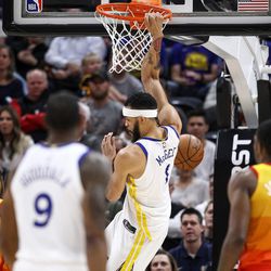 Golden State Warriors center JaVale McGee (1) puts the ball in during the game against the Utah Jazz at Vivint Arena in Salt Lake City on Tuesday, Jan. 30, 2018.