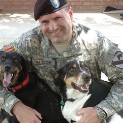This photo released Maj. Randall Baucom shows Maj. Baucom two dogs, little Girl and Buster. Baucom received word that the Army was sending him to Iraq in 2006, he immediately began to worry about what he would do with his two mixed-breed dogs.  "I didn't want to put them in a kennel for 15 months," he said. "I don't know what kind of dogs I would have gotten back if they would have been in a kennel for 15 months."