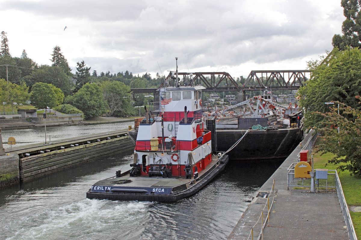 Tug boats with barge in Ballard Locks Seattle Washington State USA Pacific Coast