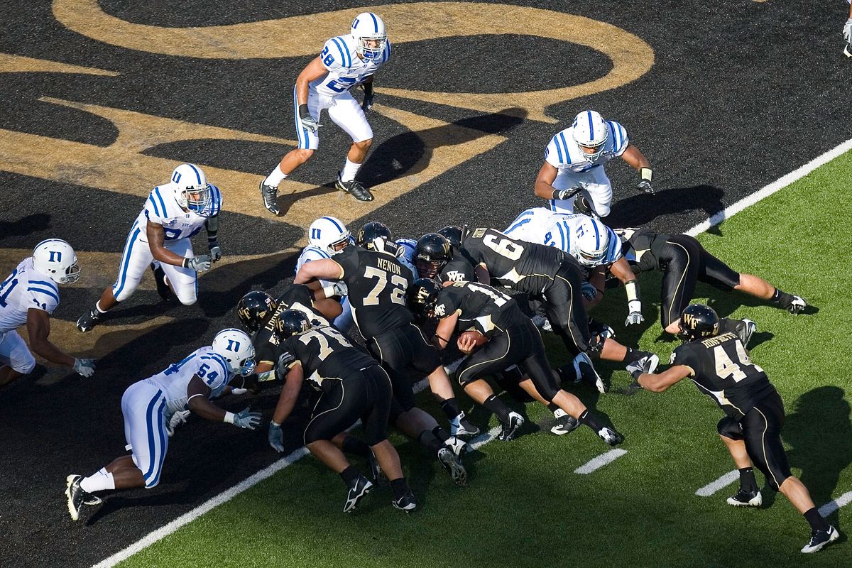 Wake Forest quarterback Riley Skinner #11 scores a touchdown during the first quarter of play versus the Duke Blue Devils at BB&amp;T Field on November 1, 2008 in Winston-Salem, North Carolina. The Demon Deacons defeated the Blue Devils 33-30 in overtime.