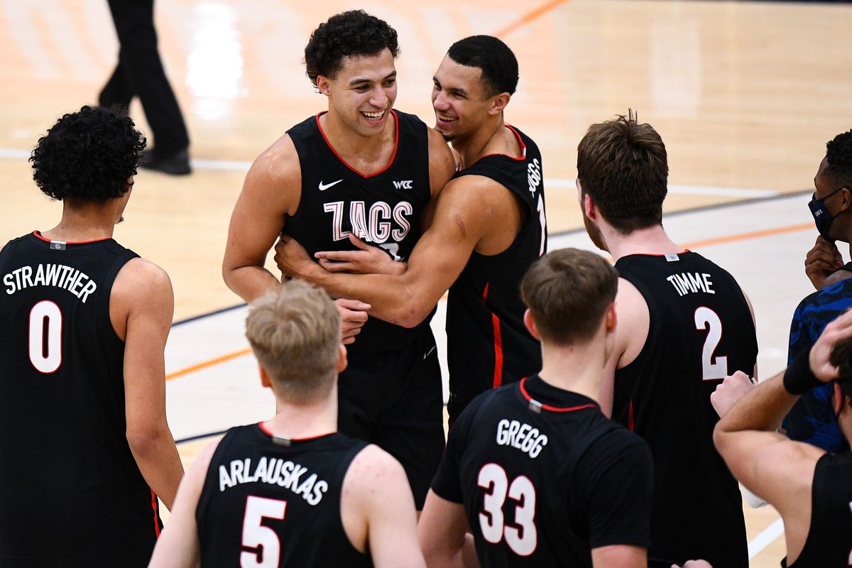Gonzaga forward Anton Watson celebrates with Gonzaga guard Jalen Suggs and his teammates after a dunk during the college basketball game between the Gonzaga Bulldogs and the Pepperdine Waves on January 30, 2021 at the Firestone Fieldhouse in Malibu, CA. The game was played without fans due to the COVID-19 pandemic.
