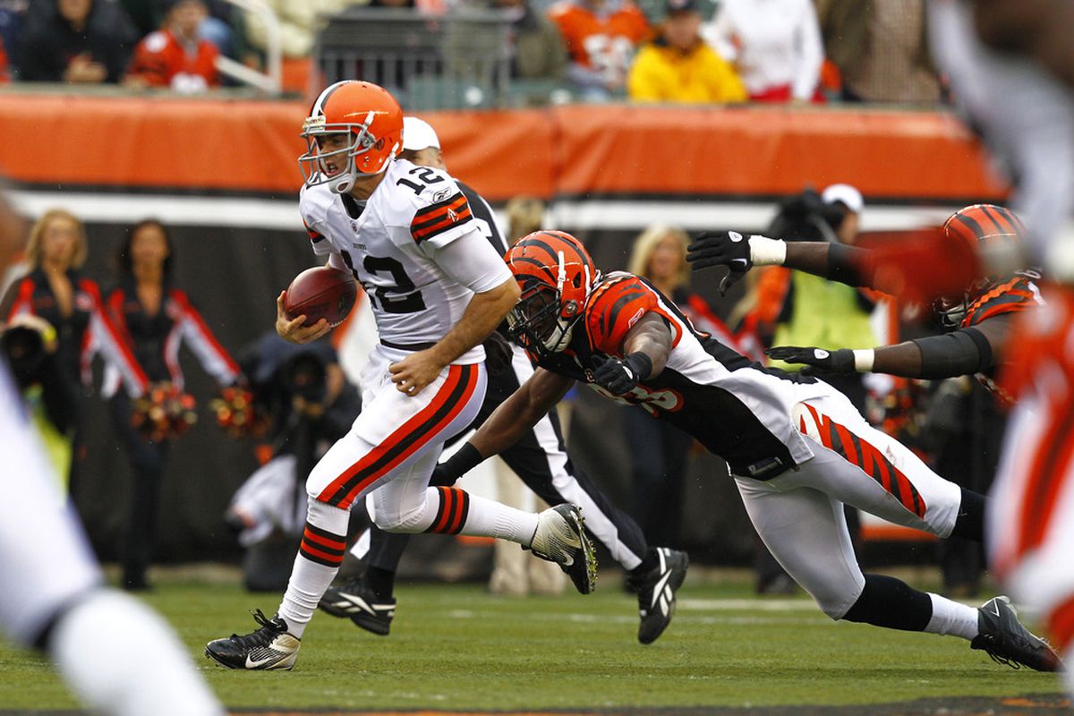 CINCINNATI, OH - NOVEMBER 27:  Colt McCoy #12 of the Cleveland Browns runs from Michael Johnson #93 of the Cincinnati Bengals at Paul Brown Stadium on November 27, 2011 in Cincinnati, Ohio.  (Photo by Tyler Barrick/Getty Images)