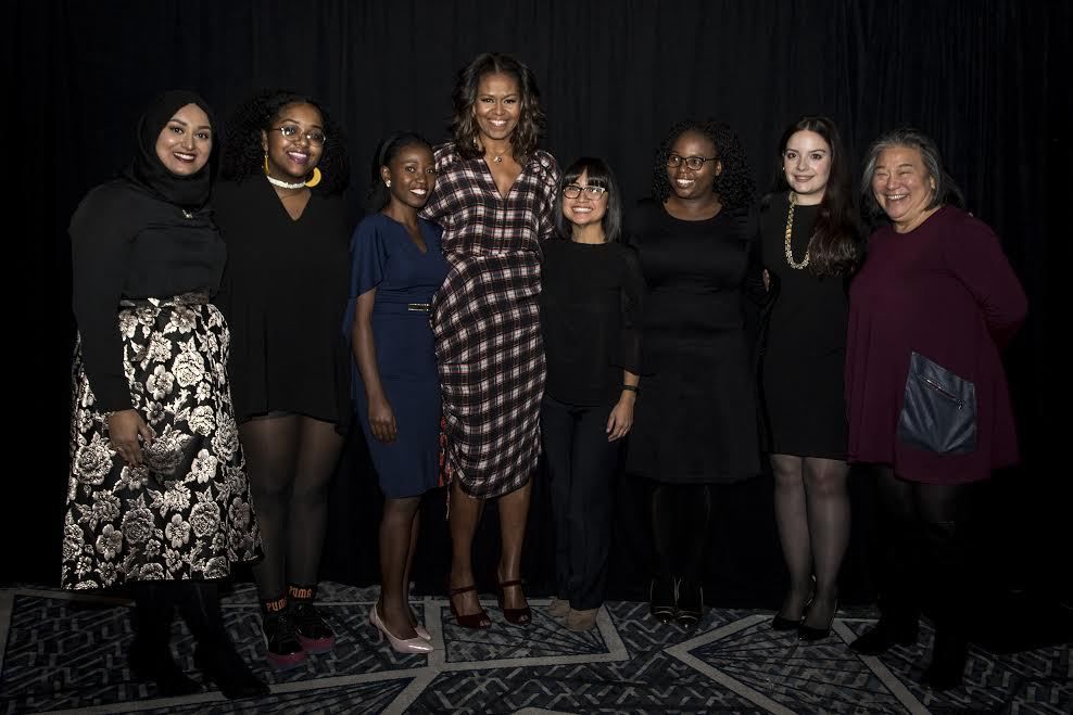 Eva Lewis (2nd from left), and six other young activists from around the world participate in an “Empowering Women and Girls Around the World” forum with former First Lady Michelle Obama, at the Obama Foundation’s first annual summit in Chicago, Nov. 1, 2