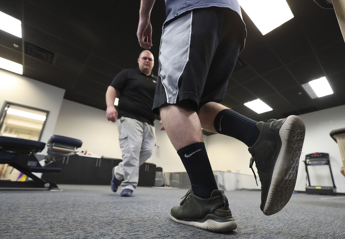 Dr. James Eagar, co-owner of the Training Room&nbsp;in American Fork, performs a physical therapy assessment on Hunter Corry on Tuesday, April 21, 2020. The Training Room has stayed open during COVID-19 pandemic.