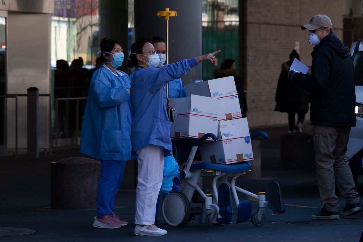Bellevue Hospital workers accept several packages during the coronavirus outbreak.