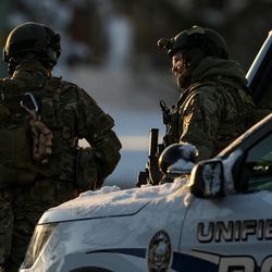 SWAT team members and other law enforcement officers respond to a situation in Taylorsville on Monday, Dec. 26, 2016.