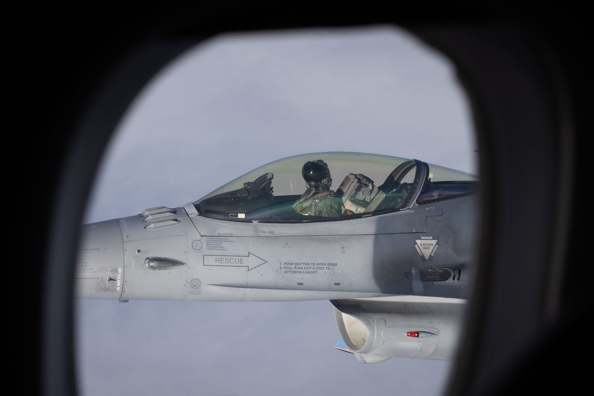 The view from one fighter jet to another while in the air.