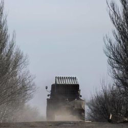 A Ukrainian multiple rocket launcher is transported towards near Artemivsk, eastern Ukraine, Monday, Feb. 23, 2015. A Ukrainian military spokesman says continuing attacks from rebels are delaying Ukrainian forces' pullback of heavy weapons from the front line in the country's east. 