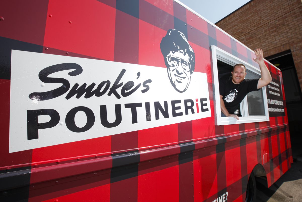 Ryan Smolkin inside of his poutine truck. Smolkin helped design the TFC crest before launching Smoke’s Poutinerie.