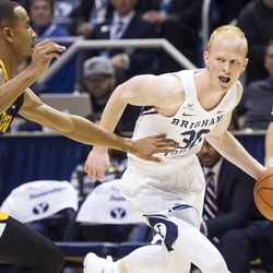 Brigham Young guard TJ Haws (30) drives to the hoop against Coppin State guard Tre' Thomas (4) during an NCAA college basketball game in Provo on Thursday, Nov. 17, 2016.