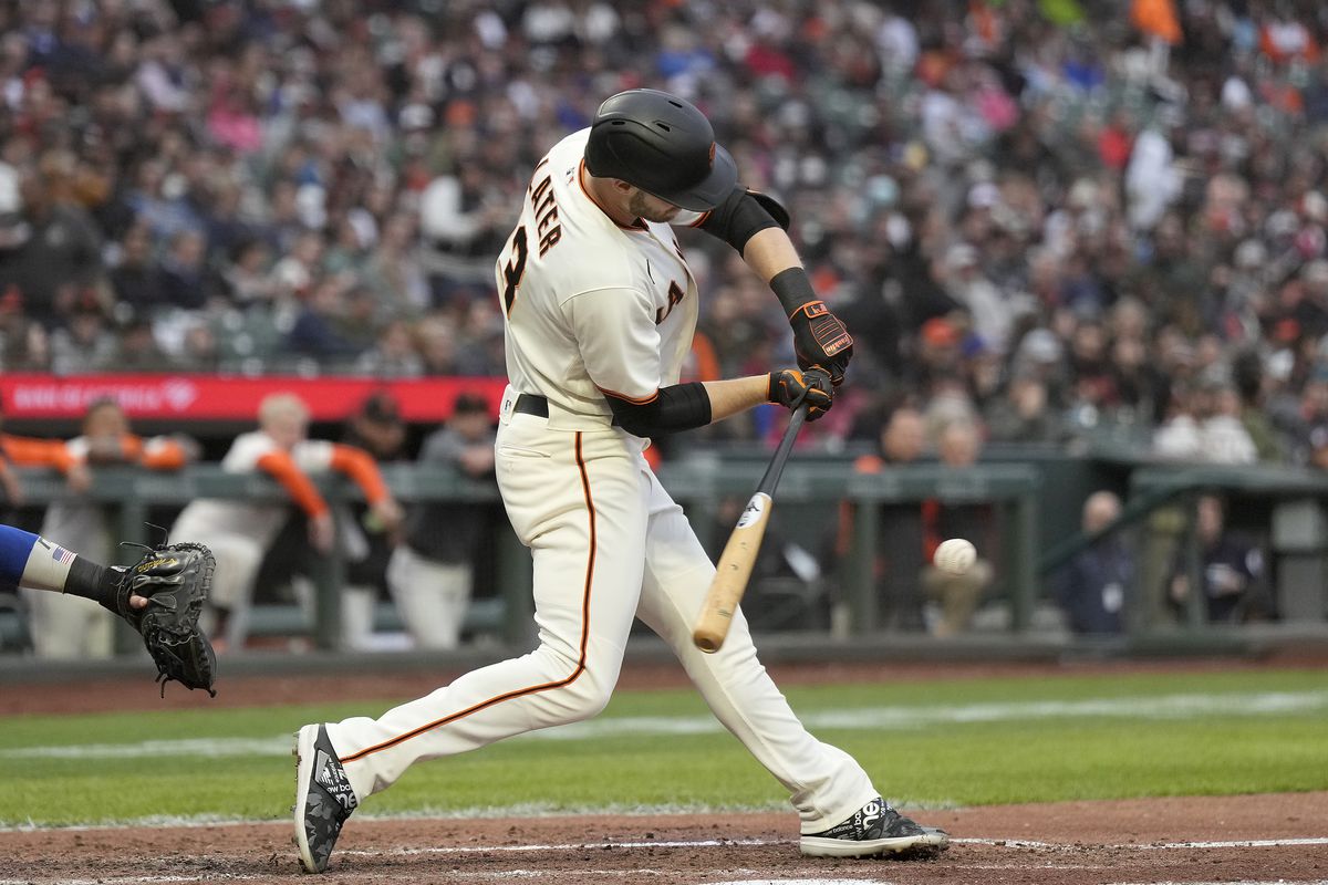Austin Slater #13 of the San Francisco Giants bats against the Chicago Cubs in the bottom of the third inning at Oracle Park on July 28, 2022 in San Francisco, California.