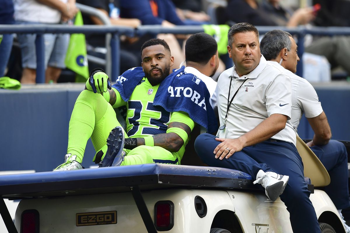 Jamal Adams #33 of the Seattle Seahawks is carted off the field during the second quarter against the Denver Broncos at Lumen Field on September 12, 2022 in Seattle, Washington.