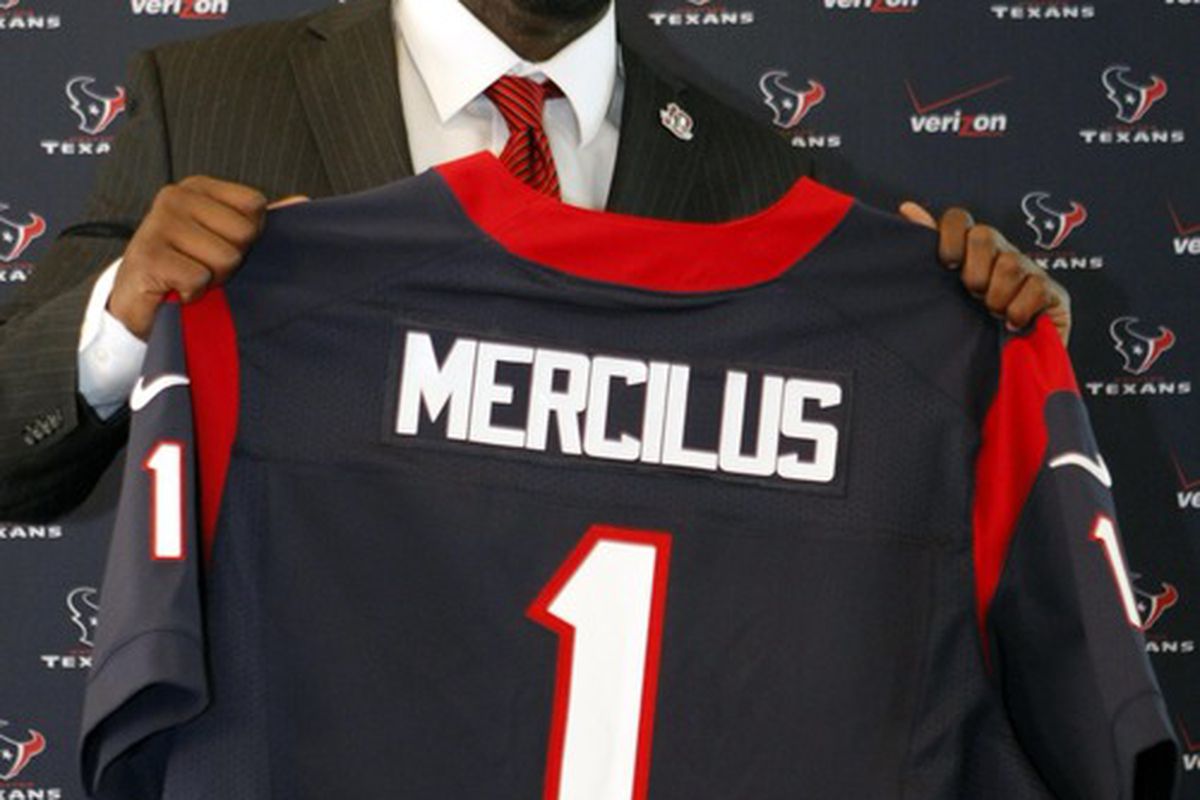 Apr 27, 2012; Houston, TX, USA; Houston Texans first round draft pick defensive end Whitney Mercilus of Illinois poses with a jersey during a press conference at Reliant Stadium. Mandatory Credit: Brett Davis-US PRESSWIRE